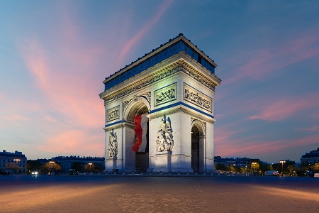 Arc de Triomphe Paris and Champs Elysees with a large France fla